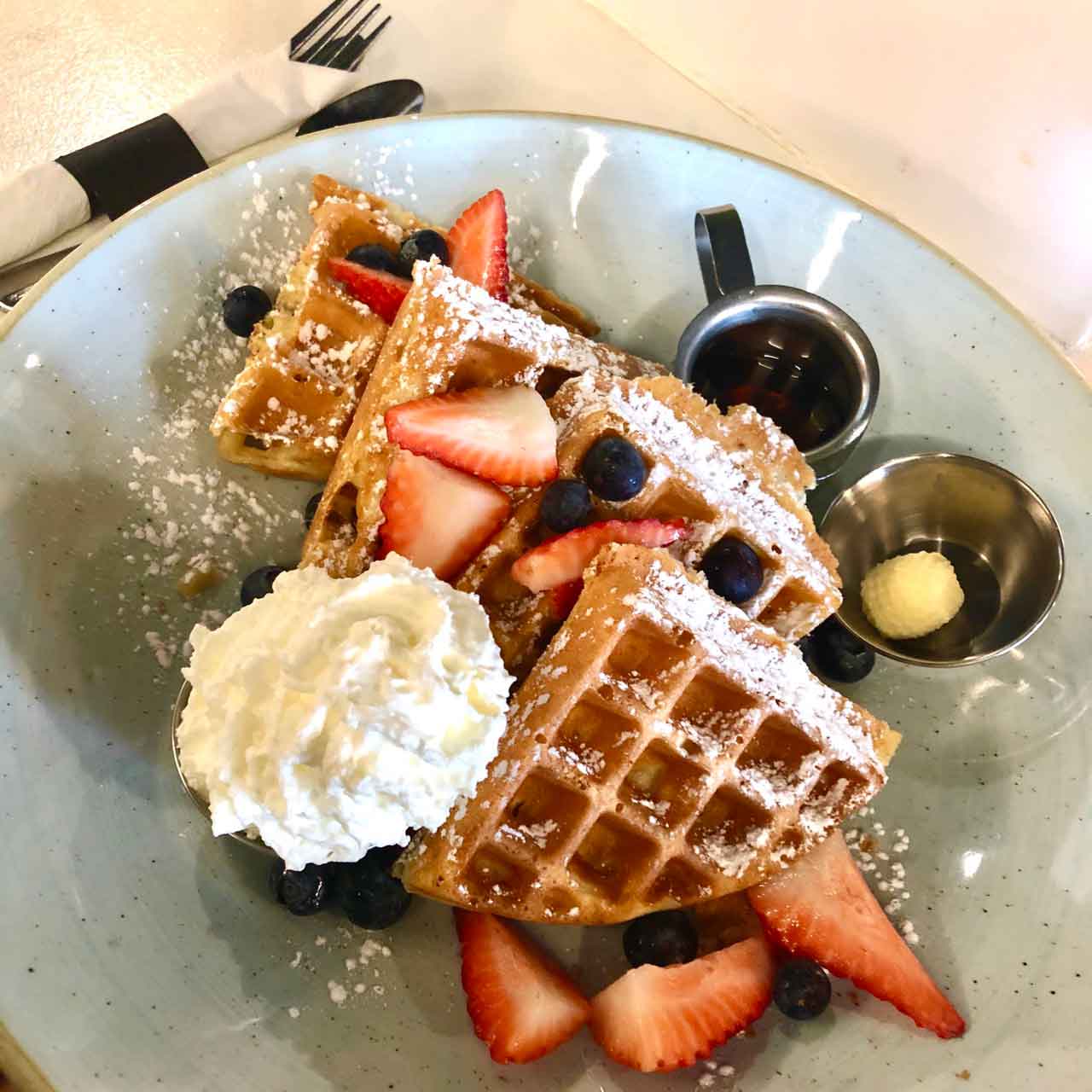 Belgian Waffles with strawberries and blueberries ($13)
